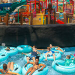 Guest enjoying relaxing lazy river at Massanutten indoor water park