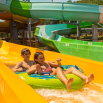 Friends enjoy riding fun tube slide at Massanutten outdoor water park