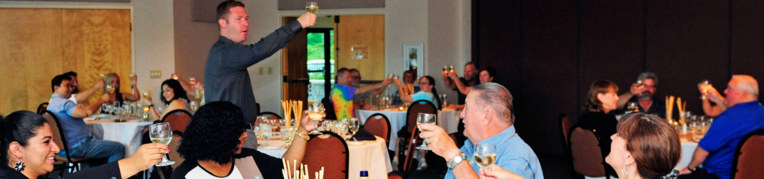 A group raising their glasses for a toast at a group event at Massanutten