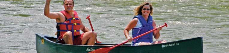 Two guests canoeing on the Shenandoah River
