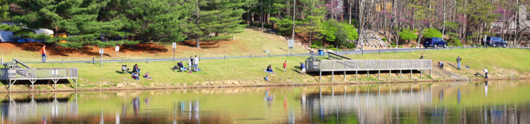 Guests fishing at Painter's Pond at Massanutten Resort