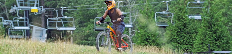 A man riding a mountain bike at the Massanutten Mountain Bike Park