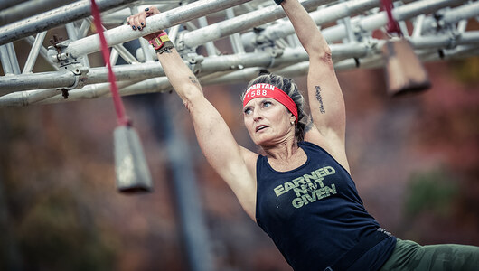 A women participating in a Spartan race at Massasnutten Resort