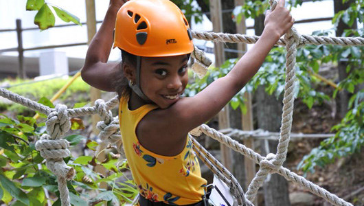 A girl on the Kids Adventure Course at Massanutten Family Adventure Park