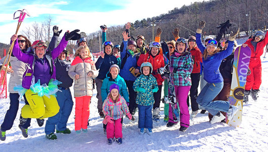 A group of guests enjoying snow sports at Massanutten Resort