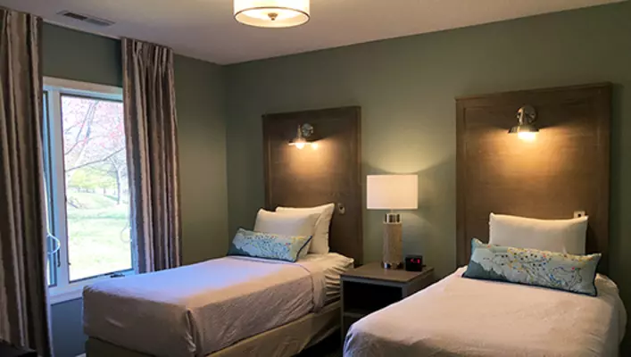 Interior photo of Woodstone Meadows condo twin beds in secondary bedroom