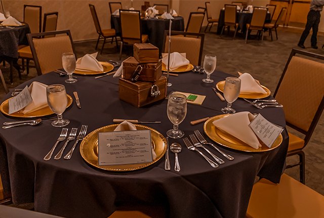 A table setting with event cards