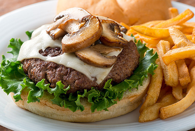 Burger with mushrooms and fries